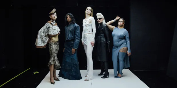 Diverse Berlin Fashion Week models posing.